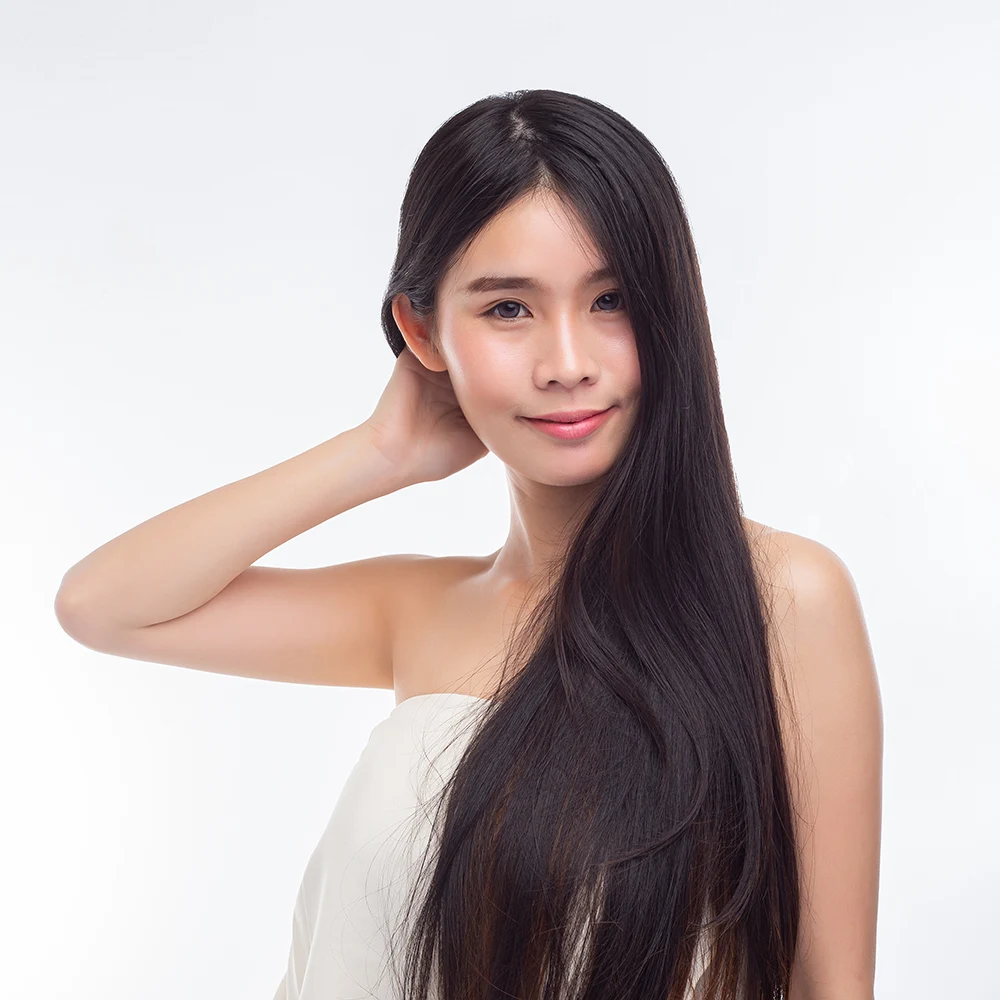 woman wearing white strapless tops hands touch her hair